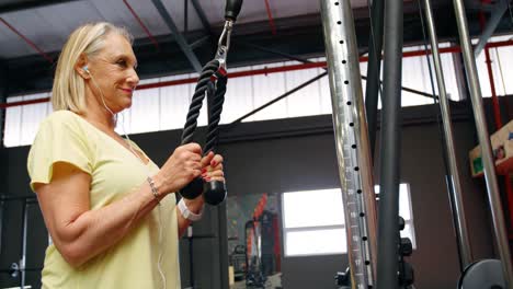 Senior-woman-doing-triceps-exercise-in-fitness-studio-4k