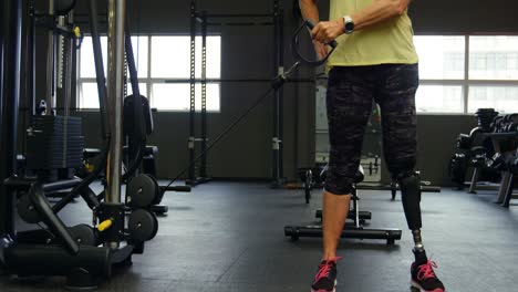 Senior-woman-doing-triceps-exercise-in-fitness-studio-4k