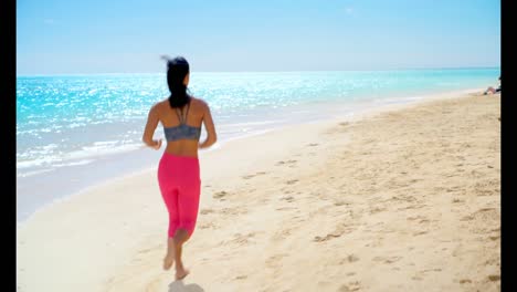 Woman-jogging-in-the-beach-4k