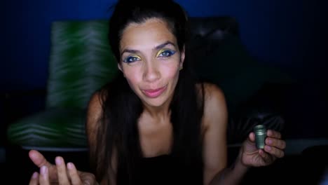 Female-video-blogger-applying-eyeshdow-4k