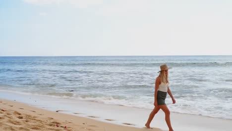 Woman-walking-on-the-beach-4k