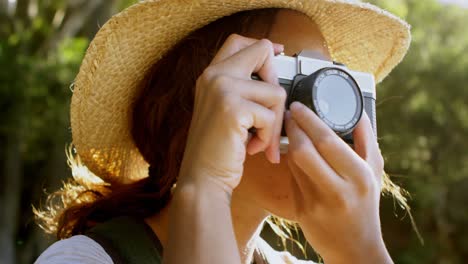 Female-hiker-clicking-photos-with-vintage-camera-4k