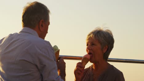 Senior-couple-having-ice-cream-at-promenade-4k