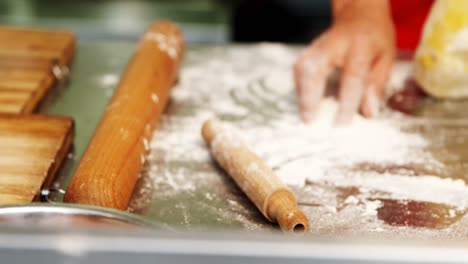 Male-baker-preparing-dough-in-bakery-shop-4k