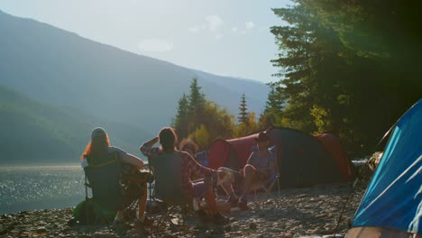 Group-of-friends-camping-near-riverside-4k