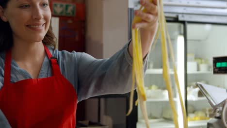 Female-baker-preparing-pasta-in-bakery-shop-4k