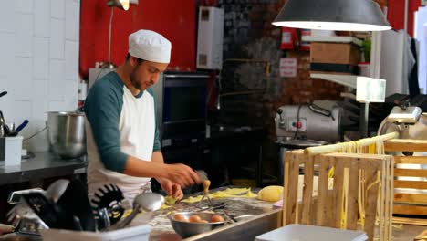 Male-baker-preparing-pasta-in-bakery-shop-4k