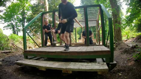 Fit-man-climbing-monkey-bars-4k
