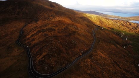 Aerial-view-of-road-passing-through-mountain-4k