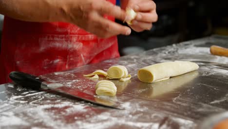 Male-baker-preparing-pasta-in-bakery-shop-4k