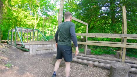 Fit-man-exercising-at-boot-camp-4k
