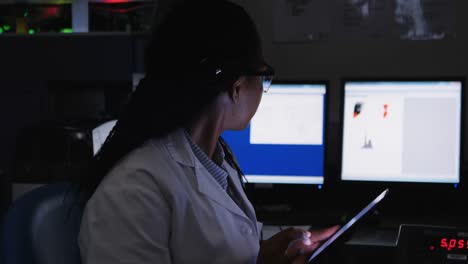 Female-scientist-using-digital-tablet-in-laboratory-4k