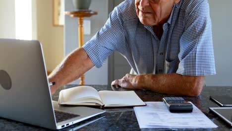 Senior-man-calculating-budget-of-household-4k