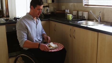 Disabled-man-having-food-in-kitchen-4k