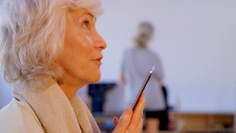 Senior-woman-talking-on-mobile-phone-4k