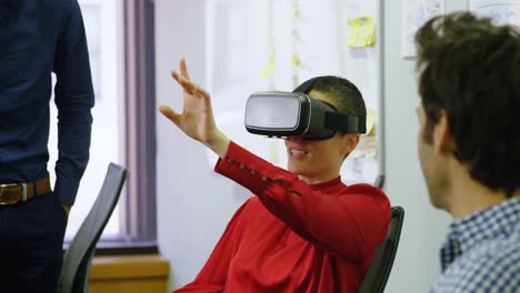 Executive-using-virtual-reality-headset-at-desk-4k