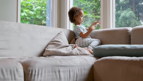 Baby-girl-using-digital-table-at-home-4k