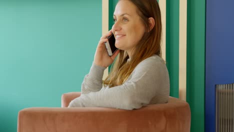 Female-customer-talking-on-mobile-phone-in-boutique-shop-4k