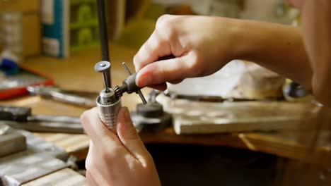 Jewelry-designer-making-jewelry-in-workshop-4k