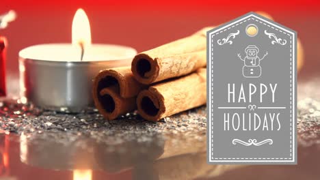 Happy-Holidays-text-with-gift,-lit-candles-and-cinnamon-sticks-4k