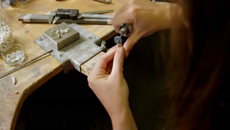 Jewelry-designer-working-in-workshop-4k