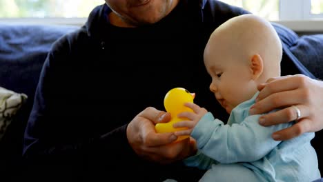 Baby-boy-with-his-father-playing-with-toy-4k