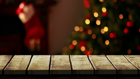 Wooden-foreground-with-Christmas-background-of-tree-and-stocking