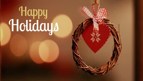 Happy-holidays-text-and-Christmas-wreath-decoration