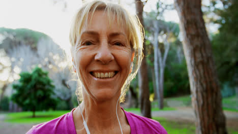 Senior-woman-smiling-in-the-park-4k
