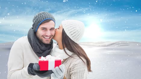 Winter-couple-with-Winter-snow-landscape-and-gift