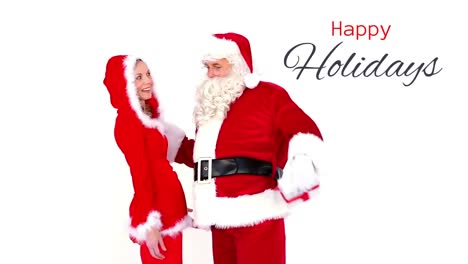 Happy-Holidays-text-and-Santa-giving-gift-to-woman