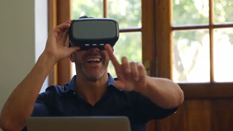 Man-using-virtual-reality-headset-in-office-4k