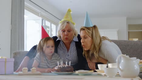 Multi-generation-family-celebrating-birthday-in-living-room-4k
