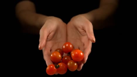 Hands-pouring-tomatoes-4k