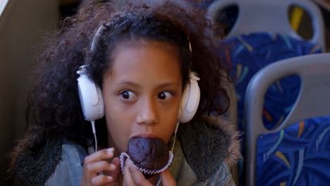 Commuter-having-muffin-while-travelling-in-bus-4k