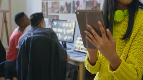 Female-graphic-designer-using-digital-tablet-in-office-4k
