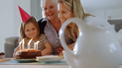 Multi-generation-family-celebrating-birthday-on-sofa-4k