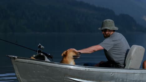 Fishermen-travelling-with-his-dog-in-the-boat-4k