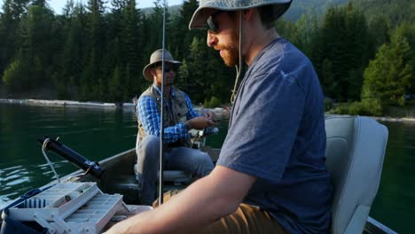 Two-fishermen-preparing-for-fishing-in-the-river-4k