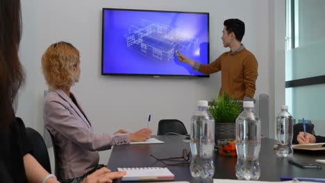 Businessman-giving-presentation-in-conference-room-4k