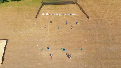 Aerial-view-of-archers-practicing-archery-at-boot-camp-4k