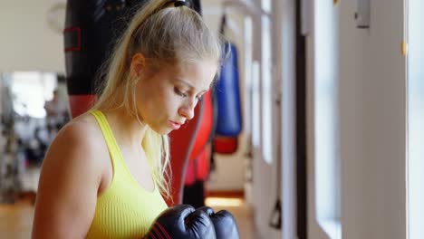 Female-boxer-practicing-boxing-4k