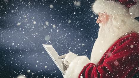 Der-Weihnachtsmann-Interagiert-Mit-Seinem-Tablet,-Kombiniert-Mit-Fallendem-Schnee