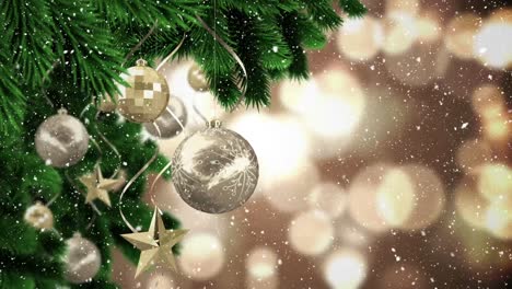 Video-composition-with-snow-over-Christmas-baubles-on--pine