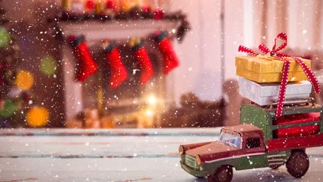 Model-car-with-presents-on-its-roof-and-blurred-background-of-a-living-room-decorated-for-christmas-