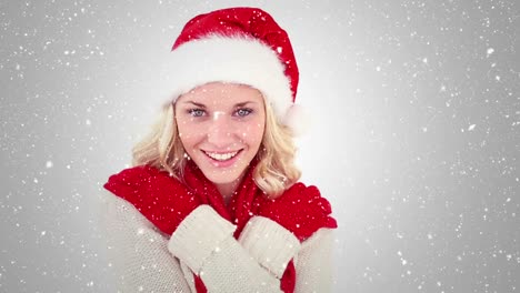 Video-composition-with-falling-snow-over-happy-girl-with-santa-hat-smiling