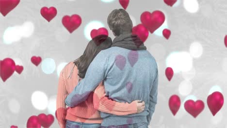 Couple-holding-each-other-with-hearts-