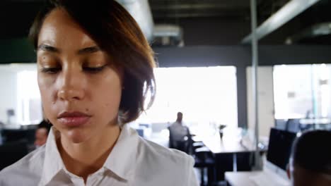 Businesswoman-using-mobile-phone-in-office-4k