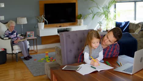 Father-helping-girl-in-her-studies-in-living-room-4k