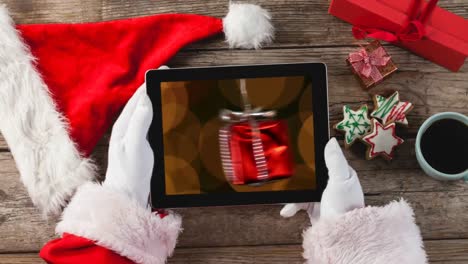Christmas-animation-of-digital-tablet-showing-hanging-Christmas-gift-4k